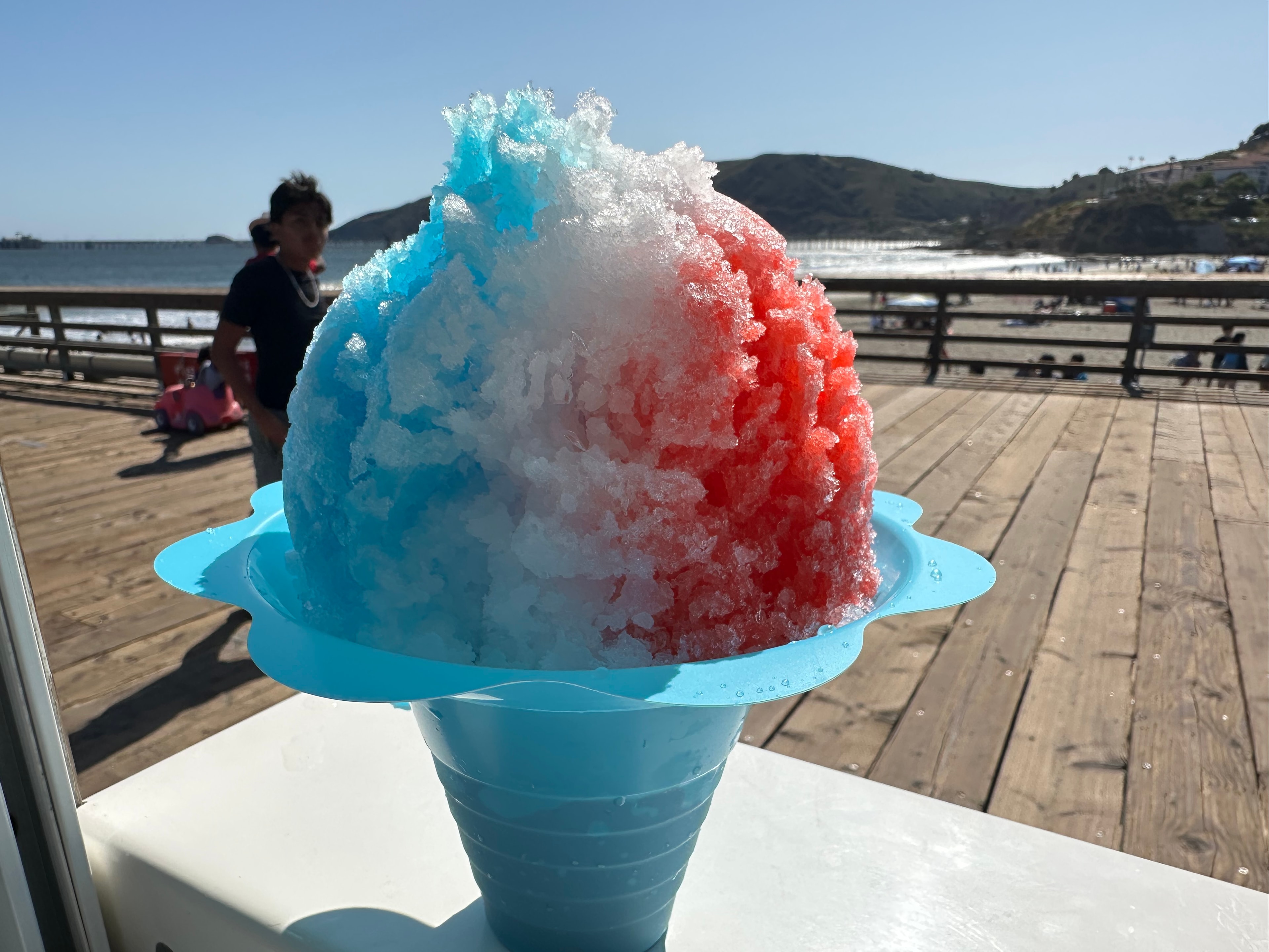 Red, white, and blue shave ice on the Avila Beach pier