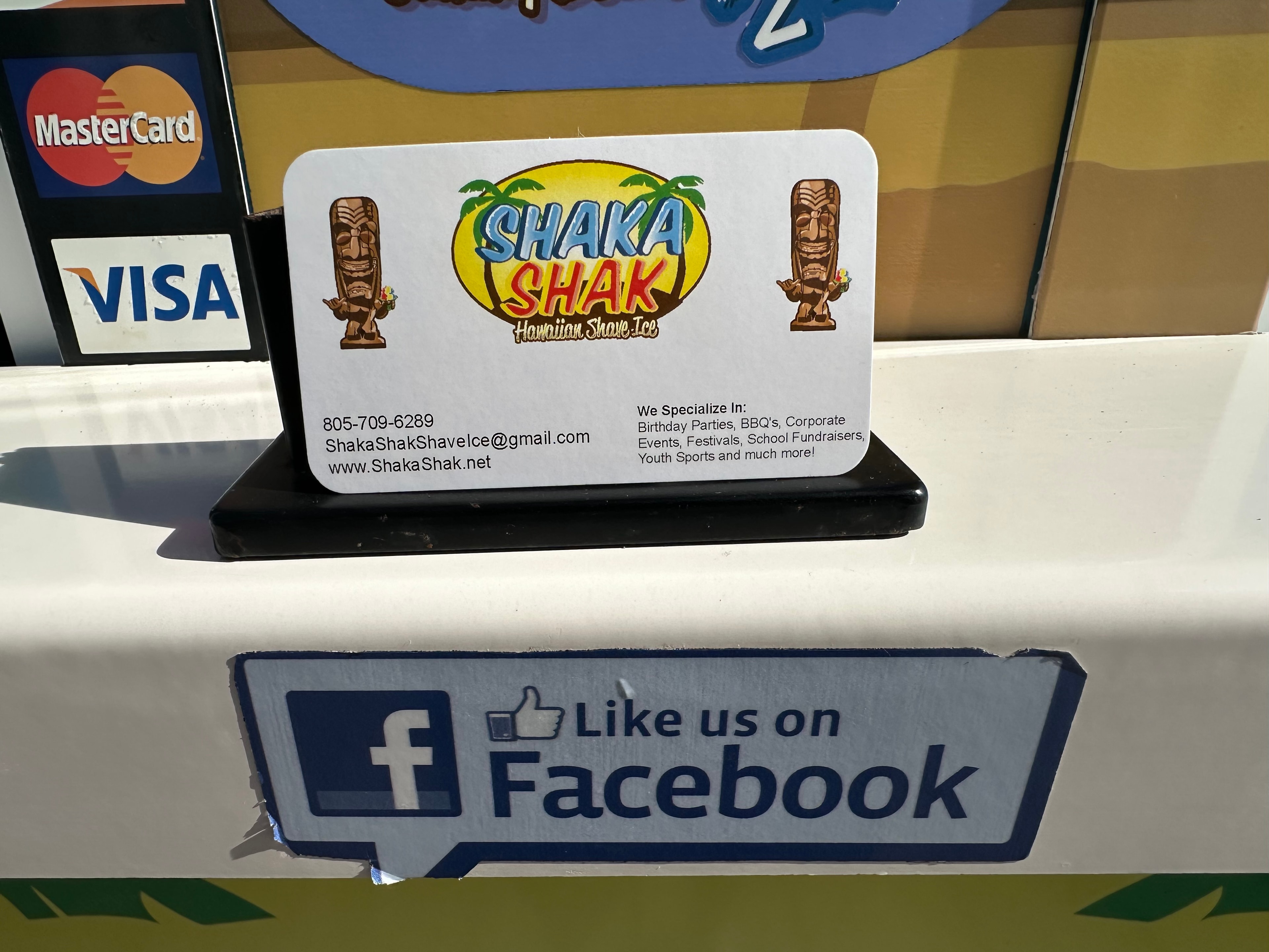 Shaka Shak business card display at the flavor station