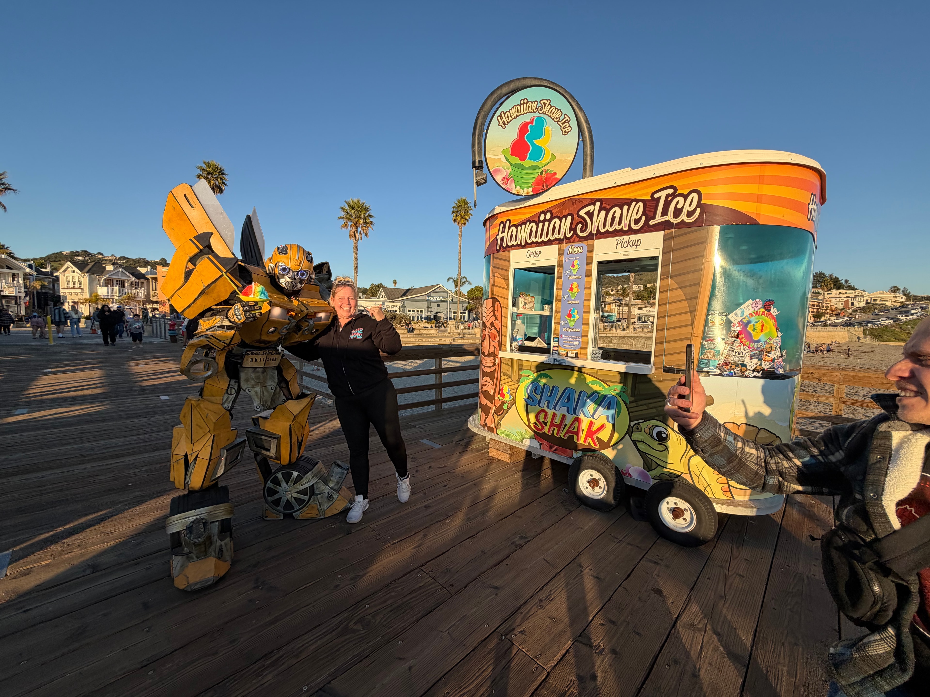 Shaka Shak Hawaiian Shave Ice kiosk with Bumblebee Transformer character on the pier
