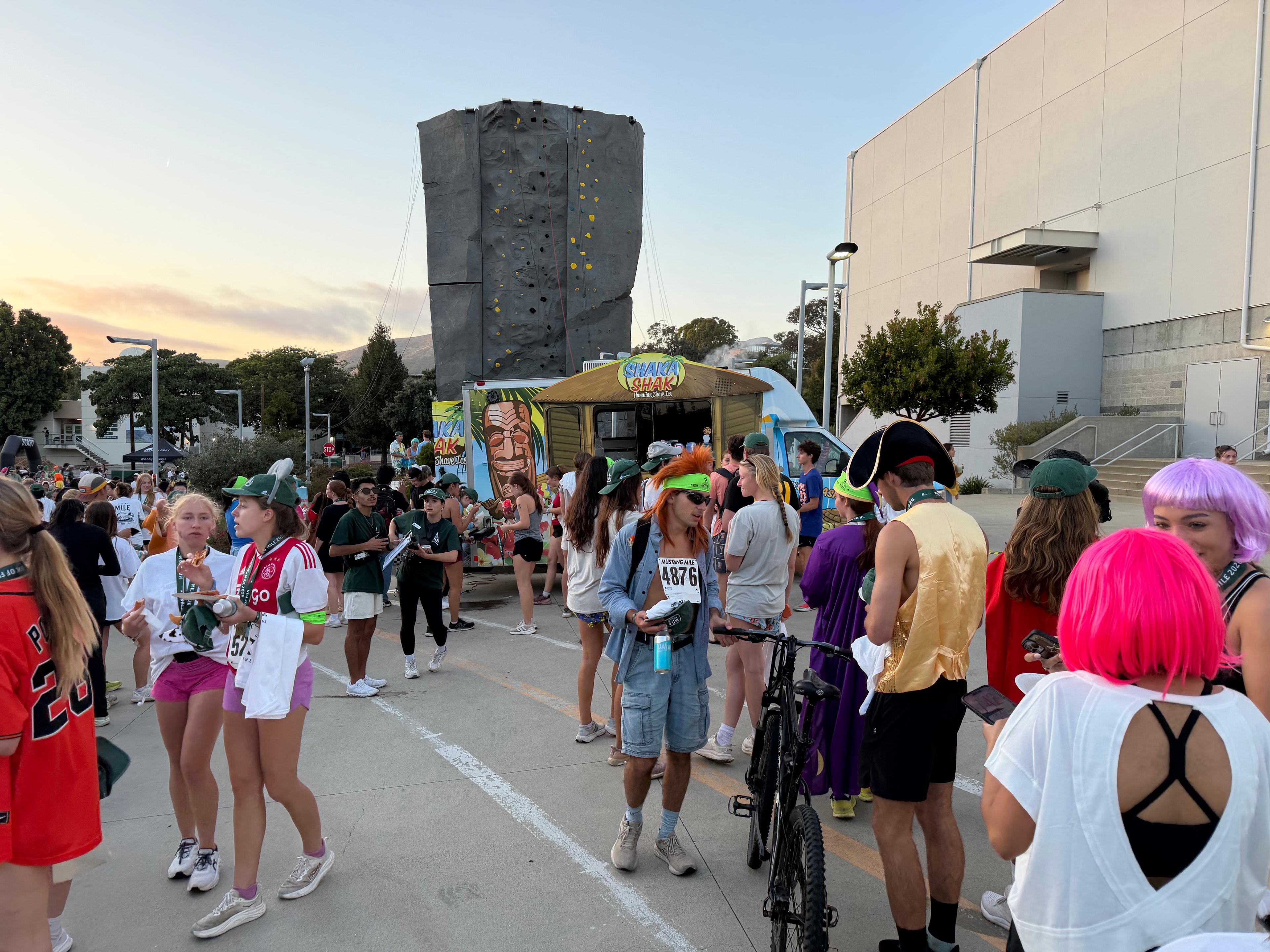 Shaka Shak food truck at the Cal Poly Mustang Mile event with a large crowd